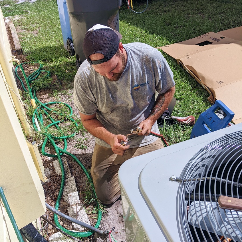 Technician Working On Unit